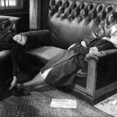 Leipzig City Council deputy mayor Dr. Lisso's wife & daughter wearing her gray Red Cross uniform, lying dead, after using cyanide w. him to commit suicide in his Town Hall office, as American soldiers enter the city at the end of WWII.